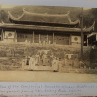 One of the temples at Monastery (No. 22). Buddhists in fore-ground - four of them holding beads-rosaries. Foreigners are Dr. S.L. Gracey and youngest son