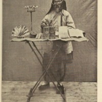 Fortune-teller with bird trained to pick out cards